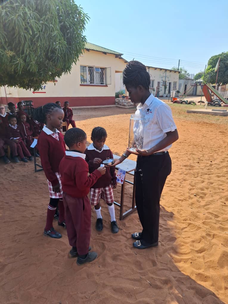 Pre-Schoolers getting their words from Teacher Sylvia.